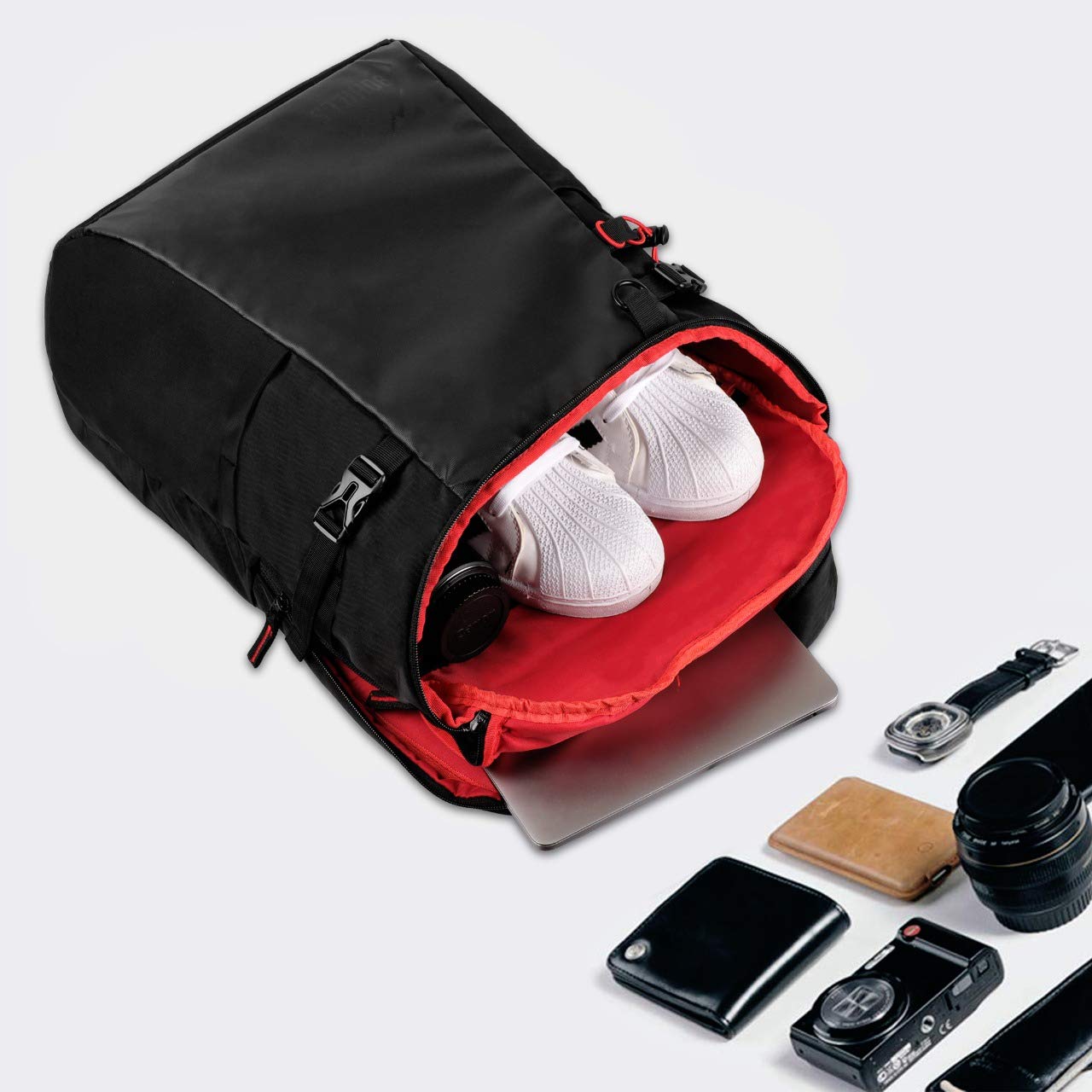 Open 90HILLS backpack packed with everyday essentials